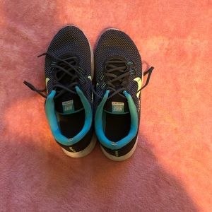 These are Black Blue and Neon Nike shoes